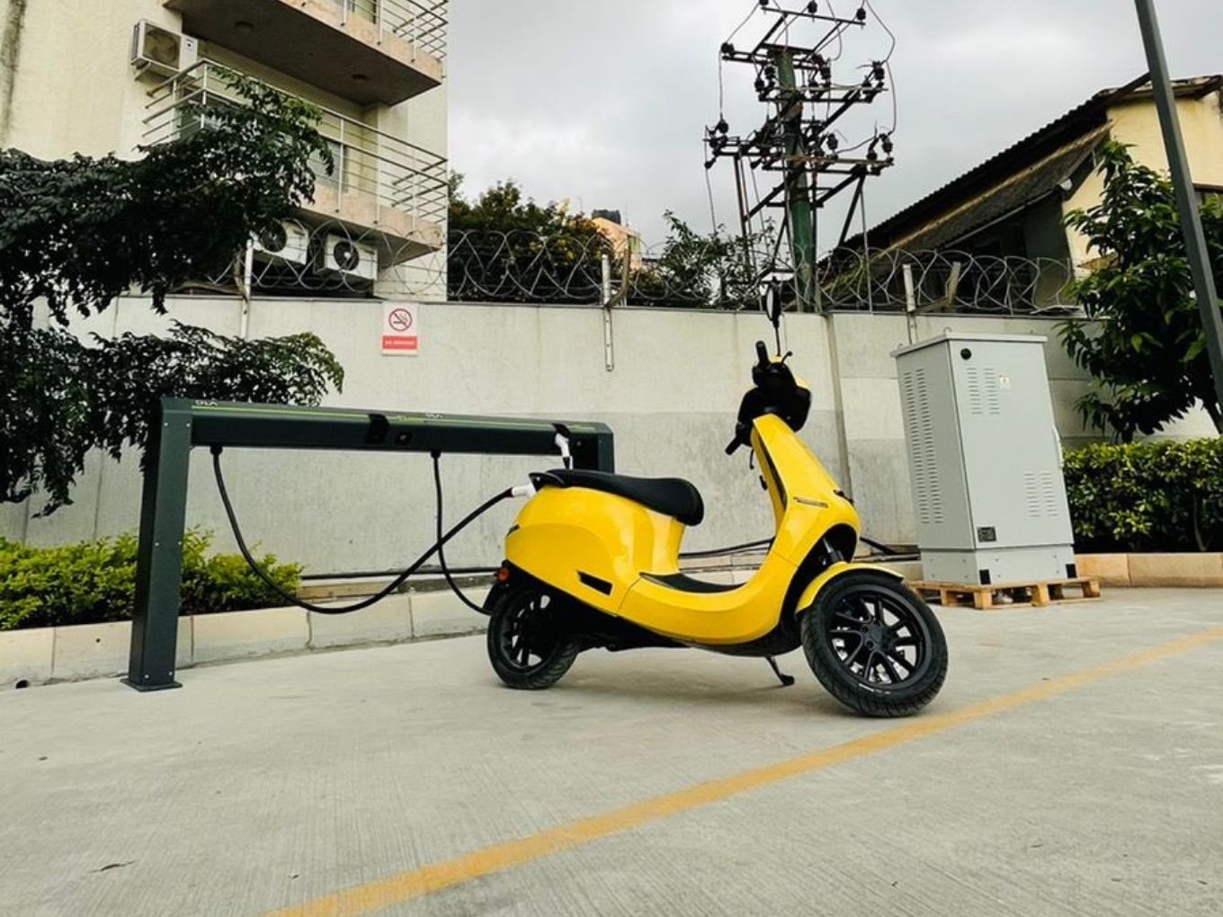 An Ola Electric scooter being charged at the first functional hypercharger in Bengaluru